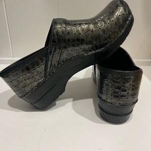 Sanita lizard print clogs.